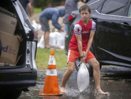 The Latest: Debby knocks out power to hundreds of thousands in Florida, Georgia